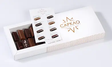 Box of 16 opened chocolates